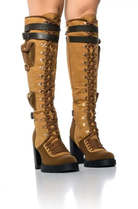 Brown Knee-High Boots with Straps and Gold Buckle Accents